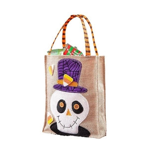 Halloween burlap tote bag featuring a skull with purple hat and orange striped handle