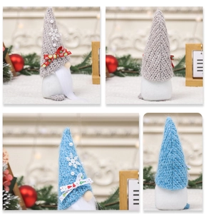 Macro view of Christmas gnome plush decor with knitted hats and white faux fur beards