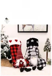 Detail of red and black buffalo plaid Christmas stockings with cute gnome doll ornaments