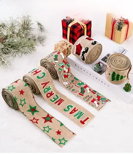Detail of Christmas burlap ribbons with festive star and Santa Claus printed patterns
