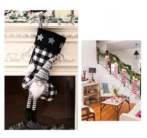 Detail of buffalo plaid Christmas stocking featuring a 3D gnome and plush star trim