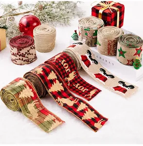 Close-up of Christmas burlap ribbons with reindeer and snowflake patterns for DIY decor