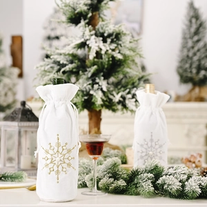 White plush Christmas wine bottle cover with embroidered snowflakes and pearl accents