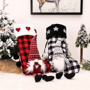 Red and black buffalo plaid Christmas stockings with gnome plush dolls for tree decoration