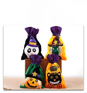 Detail of velvet Halloween gift bags with skull witch pumpkin and black cat designs