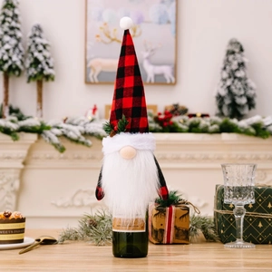 Festive Christmas gnome wine bottle cover with red buffalo plaid hat and white beard decoration