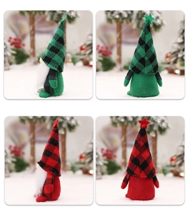 Macro view of Christmas gnomes with plaid hats showing knit fabric and beard details