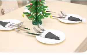 Mini grey Christmas hat cutlery holders for table decor featuring soft white pompom detail