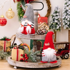 Set of two plush Christmas gnomes with pointed hats and Merry Christmas labels