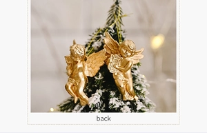Detailed back view of vintage gold angel ornaments hanging on a snowy Christmas tree