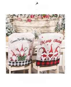 Close-up of festive Christmas gnome chair covers with Merry Christmas text for dining decor