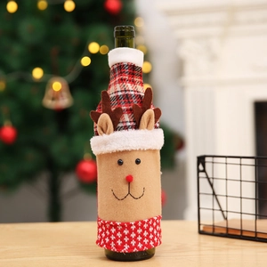 Christmas reindeer wine bottle cover in red knit fabric for festive dining table decor