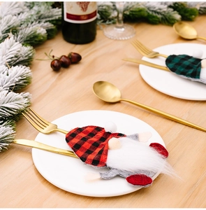 Plaid Christmas gnome cutlery holder set featuring white beard on festive holiday table