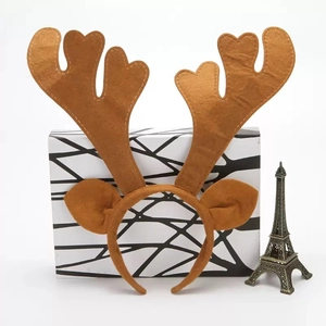 Detailed view of brown felt reindeer antlers with decorative white stitching and ears