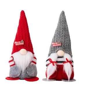 Pair of red and gray Christmas gnomes with Merry Christmas embroidery on knitted hats