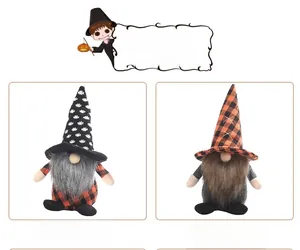 Detail view of two Halloween gnomes with polka dot hats and plaid bodies for festive decor