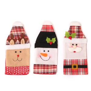 Three Christmas wine bottle covers with Santa, Snowman and Reindeer in plaid fabric