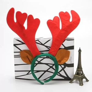 Detail view of a Christmas reindeer antler headband with red antlers and brown ears