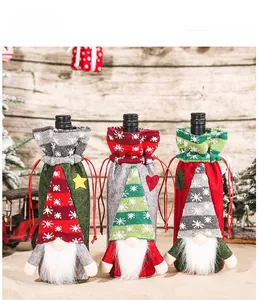 Three festive Christmas gnome wine bottle covers in red, green and grey knit fabric