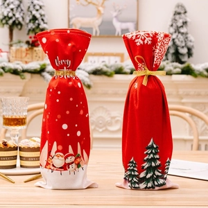 Christmas wine bottle gift bags with Santa and snowman patterns for holiday table decor