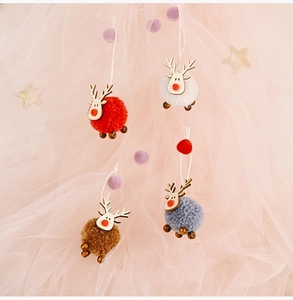 Detailed set of four felt reindeer ornaments in red white brown and grey for Christmas trees