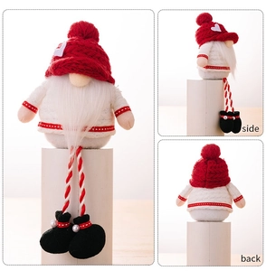 Multiple views showing the front, side and back of a red heart Christmas plush gnome