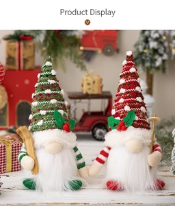 Detail of Christmas gnomes with knitted hats and wooden skis in a festive holiday setting
