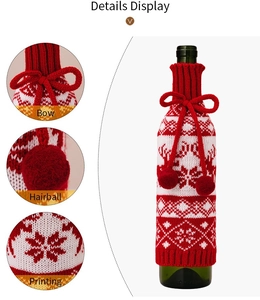 Detail view of knitted Christmas wine bottle cover featuring reindeer motifs and bow