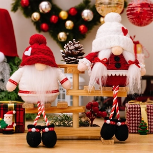 Detailed view of red and white Christmas gnomes with long legs on a rustic wooden ladder