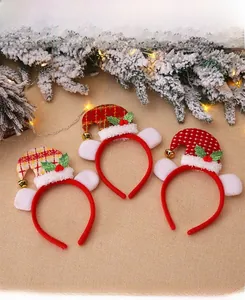 Detailed view of Christmas headbands with plaid mini hats, white fur, and golden bells