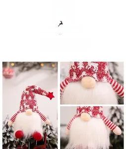 Close-up detail of knitted Christmas gnome with reindeer patterns and plush white beard