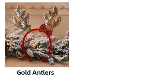 Detail of a Christmas headband featuring golden glitter reindeer antlers with a red bow