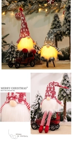 Detail of glowing Christmas gnome plush with knitted reindeer hat for festive home decor