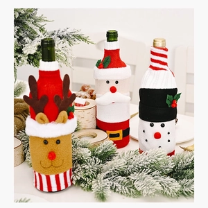 Detailed view of Christmas wine bottle covers with reindeer, Santa, and snowman designs