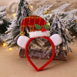 Christmas headband with red plaid mini santa hat and white fuzzy ears on wood stand
