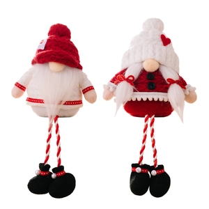 Christmas faceless gnome ornaments with long striped legs and knitted hats for festive decor