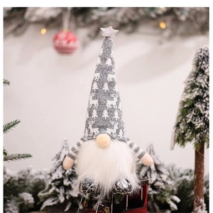 Close-up of a glowing Christmas gnome with elk pattern hat and festive bokeh background