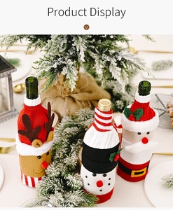 Detailed view of Christmas wine bottle covers featuring Santa, reindeer, and snowman designs
