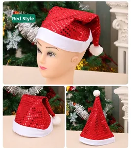 Detail of red sequined Santa hat with white plush trim and fuzzy pom-pom on top