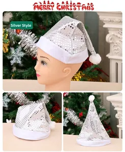 Detail of silver sequined Christmas hat with white plush trim and fuzzy pom-pom ball