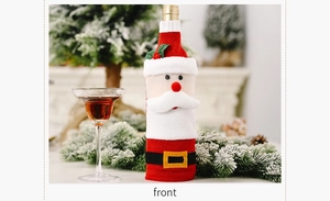 Close-up of Santa Claus knitted wine bottle cover with plush beard and belt detail