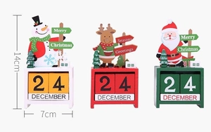 Detail view of 14cm wooden Christmas countdown calendar blocks with Santa and elk figures