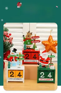 Close-up of wooden Christmas countdown calendar with Santa, snowman and reindeer designs