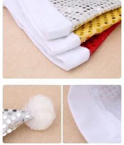 Close-up of sequined Christmas hats in silver, gold, and red with plush white trim details