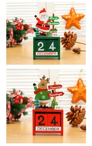 Detail of wooden Christmas countdown calendars with Santa and Reindeer desktop blocks