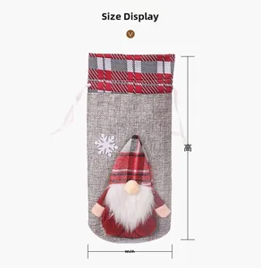 Detailed view of grey linen Christmas wine gift bag with gnome doll and size measurements
