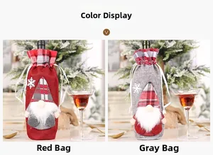 Detail of Christmas wine bottle bags featuring gnome embroidery and drawstring closure