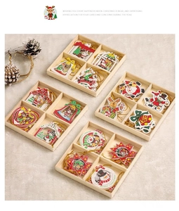 Set of 12 hand-painted wooden Christmas ornaments with festive reindeer and snowflake designs