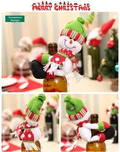 Detailed views of festive snowman wine bottle cover with red scarf and hat decoration