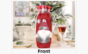 Front view of Christmas gnome wine bottle cover with red plaid hat and white beard